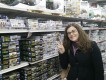 Luisa Harajuku-style in front of a pile of Tamiya model kits.